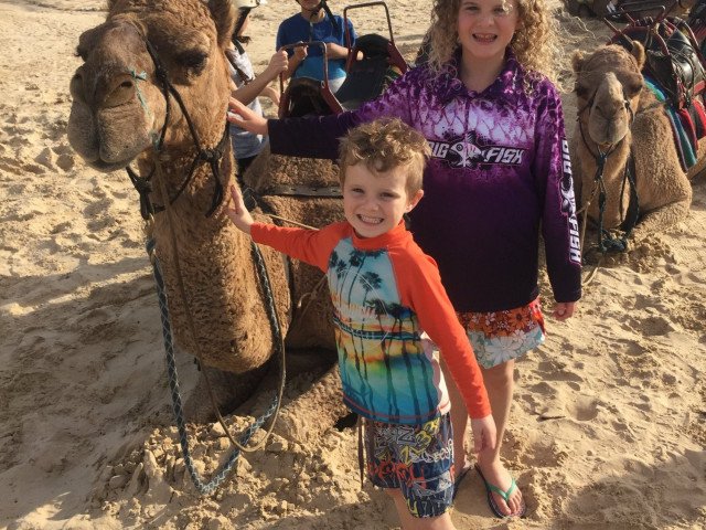 Ride a camel at Birubi Beach